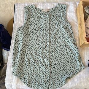 Woman’s light blue/green blouse